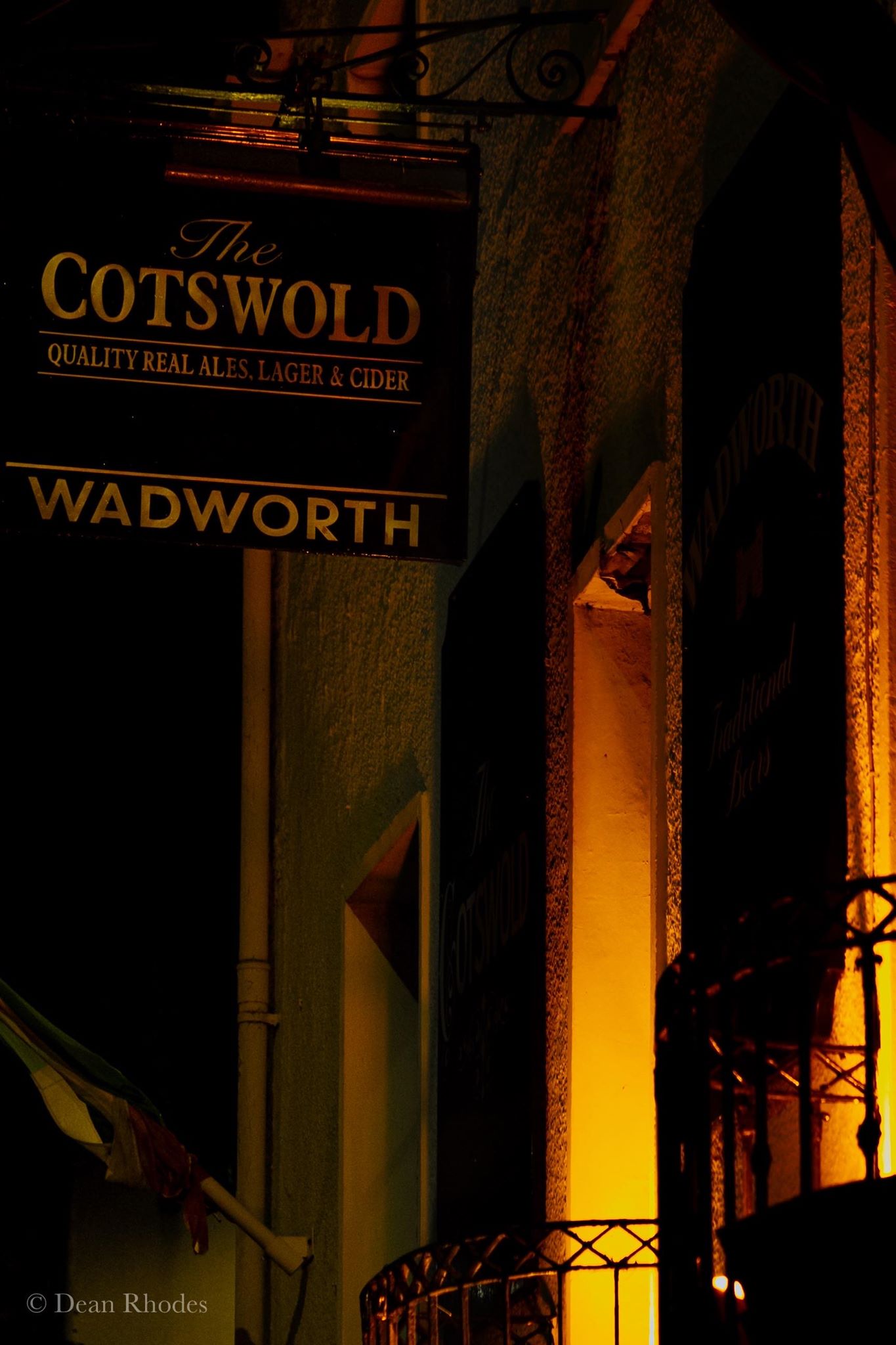 The Cotswold Inn sign outside the venue