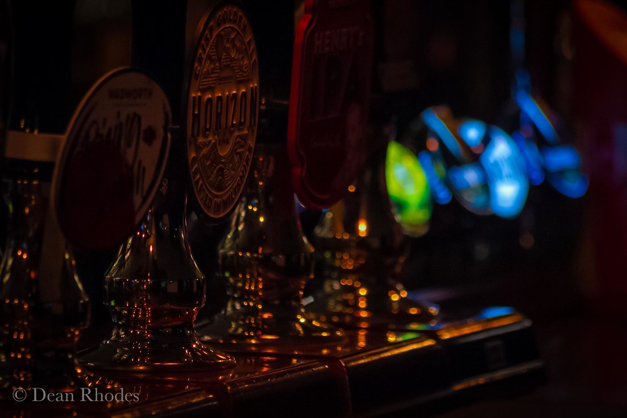 Beer pumps lined up at the bar